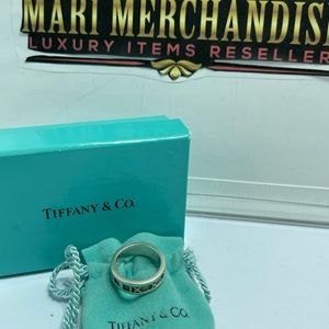 - Tiffany and Co. Atlas Ring size6 in silver 925. Comes with pouch and box.